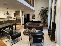 Stunning and private mid-century modern inspired cottage nestled in the woods.