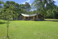 Secluded 4 bedroom farmhouse nestled on 8 acres with large lawn and oak trees.
