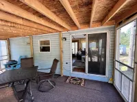 Parkmodel cabin w screened porch in campground on bike trail.