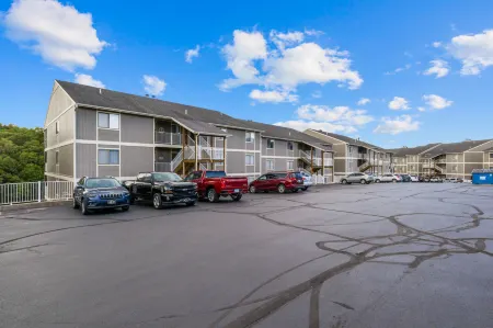 Cozy Condo with Rock Fireplace and Pool - Gorgeous Waterfront Oasis