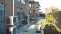 Stopforths Premium Accommodation Hotels near Hokitika Beach Sign