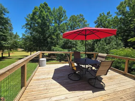 A charming cottage, recently renovated in a serene wooded area of Hanceville, AL