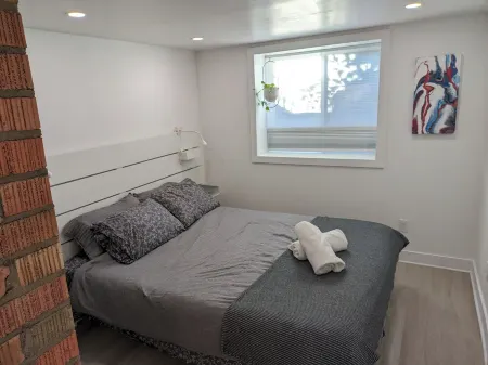 The Apartment.  Cozy one bedroom modern place.  Close to downtown and breweries