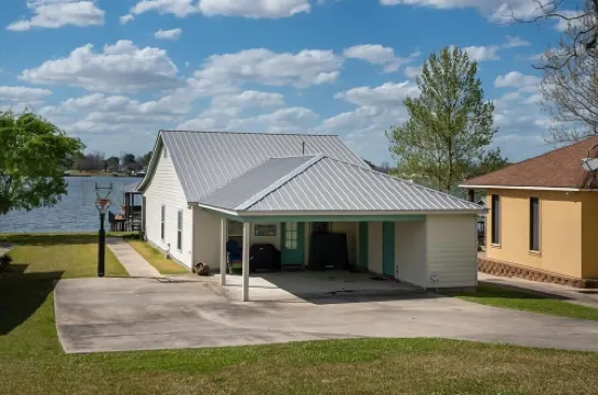 Screened porch and private pier on False River