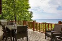Secluded Log Cabin Retreat on 11 Wooded Acres with Hot Tub & Lake Michigan Views