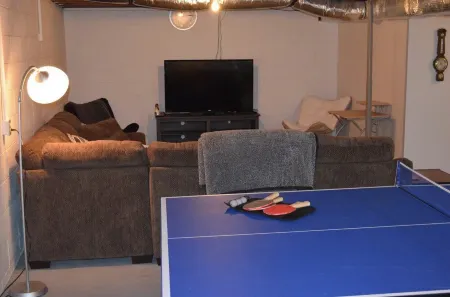 Country Setting with Mature Trees, Large Deck. Game/Rec Room, Fire Pit and Grill