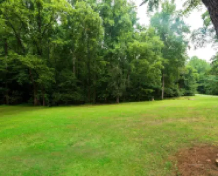 Vintage charm meets modern comfort in this historic 1850s cabin at Lake Hartwell