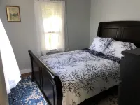 Rustic vintage cottage in Duck Cove with limited ocean view.