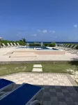 The Harvey Nicole: Modern Caribbean Ocean Front Condo Grand Cayman. - Beach