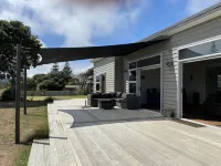Brand New 3 Bedroom Beachfront Getaway.  Beach just across the road.