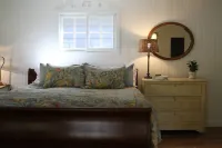 Charming studio cottage on quiet street with beautiful landscaping and gardens.