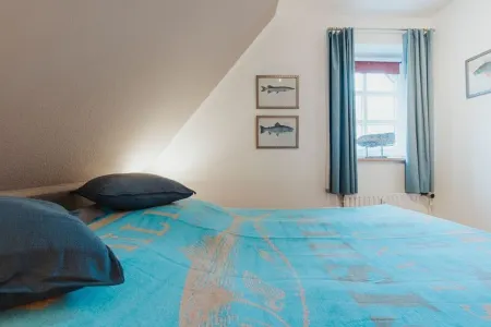 The modern apartment - Rosenhain 12, No. 6 - is located 800 meters from the sea. Отели в г. Тиммендорфер-Штранд