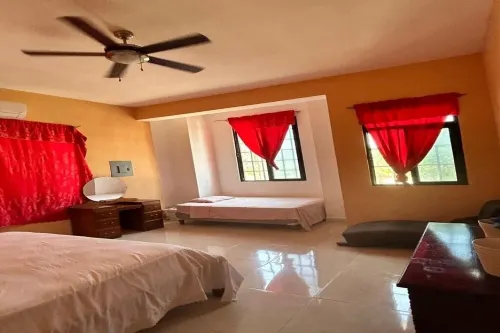 Nature view in a quiet urban neighborhood 1-bedroom house with WiFi and AC Hotels in Corozal