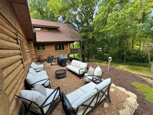 Gorgeous XL Log Cabin in Bloomington, IL! 2 Game Rooms + Hot Tub & Sauna!
