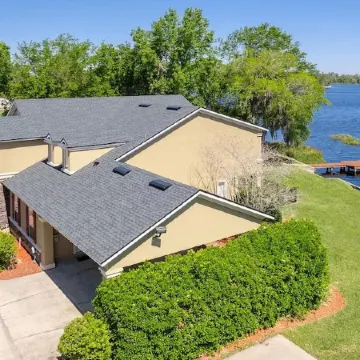 Lakeside Retreat~ Large home with pool, dock, game room and balcony on lakefront