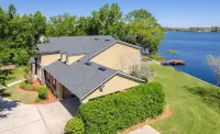Lakeside Retreat~ Large home with pool, dock, game room and balcony on lakefront