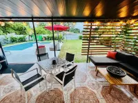 Modern Vacation Home with pool- Conveniently located to Restaurants & Beach