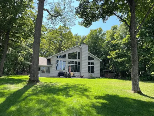 Lakeside home on one acre with private beach 90 minutes from the Twin Cities