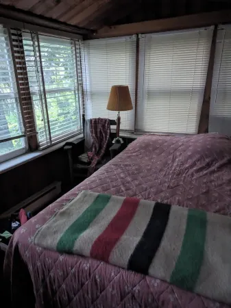 Direct lakefront cottage with wood burning fireplace in great room. Pet friendly