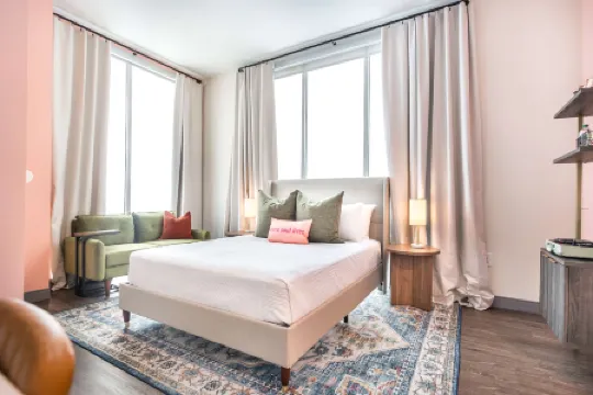 Floor-to-Ceiling Windows and Full Kitchen Amenities - Bold Chic