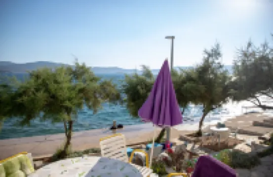 Villa Vedran apartment Vedran B with sun beds facing the sea