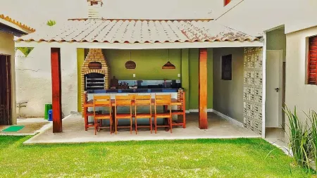 House with pool 50 m from the beach Отели в г. Гуарахуба