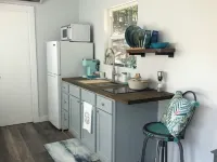 Charming shipping container home with lake view and boat ramp.
