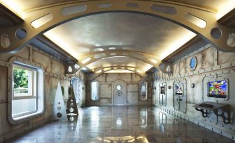 a long hallway with a chandelier hanging from the ceiling , illuminated by lights on both sides at Adrián Hoteles Roca Nivaria