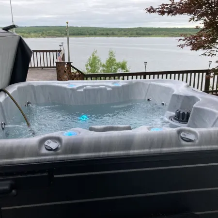 Spectacular lake view with a huge deck and a Hot Tub.