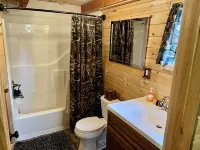 Loft cabin nestled in the woods with two acres to yourself.