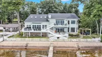 6BR Houghton Lake House w/ Indoor Pool, Hot Tub, and Golf Simulator - Sleeps 24