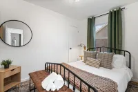 Urban Oasis: A Charming Downtown Retreat with Game Room, Firepit and Yard Games