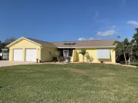 Waterfront single home rental with private lanai, heated pool, and hot tub!