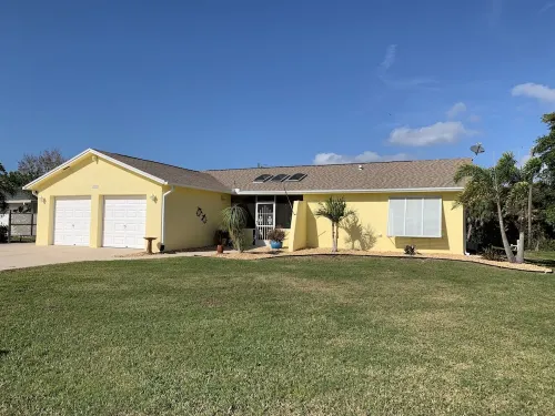 Waterfront single home rental with private lanai, heated pool, and hot tub!