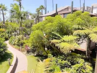 Beautiful End Unit Single Level Condo North Coast Village - Walk to the beach!!
