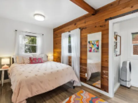 Darling pink beach house with epic views in a cozy community.