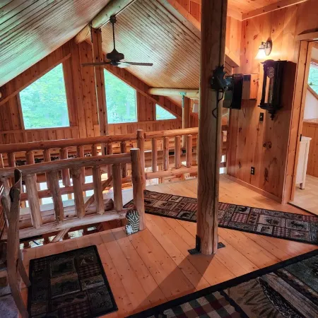cozy lake house, full log cabin on beautiful shell lake, w/ wonderful loft.