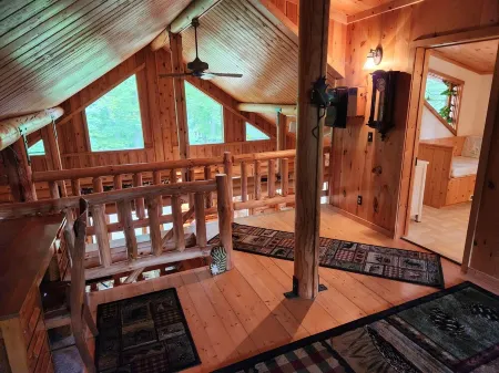 cozy lake house, full log cabin on beautiful shell lake, w/ wonderful loft.
