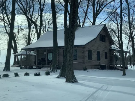 Modern Log Cabin in woods with two gas fireplaces; 20 acres; great location.