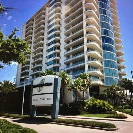 Floor to Ceiling Windows Overlook the Gulf of America's Pristine White Beaches