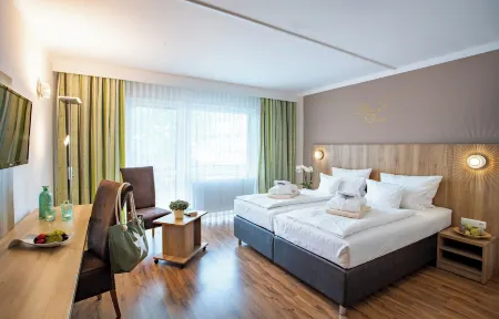 Aqualux Wellness- & Tagungshotel Отели в г. Лаутербах