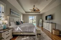 Spacious waterfront villa w 2 master suites, a junior suite, heated pool and spa