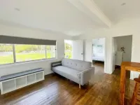 Lakeside House Tuncurry with deck overlooking the lake Hotels in Tuncurry