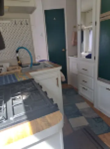 Cute RV in the  forested mountains at Cedar Ridge,  Sonora for your vacation.
