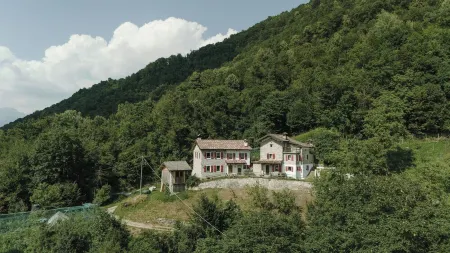 Completely renovated old farmhouse in the heart of the Dolomites. Отели в г. Borgo Valbelluna