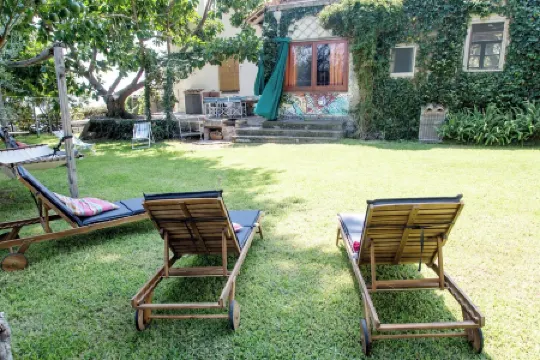 Old barn surrounded by greenery a few meters from the sea in le ripe estate