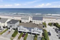 Not quite ocean front, but almost! Just a few steps to the sand! Pet friendly. - Hot Tub