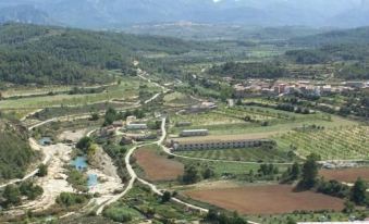 a bird 's eye view of a rural area with roads , fields , and mountains in the background at La Contrada
