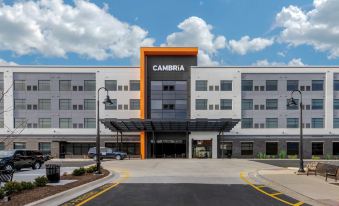 "a large building with a sign that says "" cambria "" on the front , surrounded by a parking lot" at Cambria Hotel - Arundel Mills BWI Airport