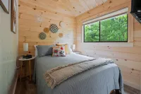 The Mighty Acorn, Bungalow is a delightful cozy tiny home in the woods.